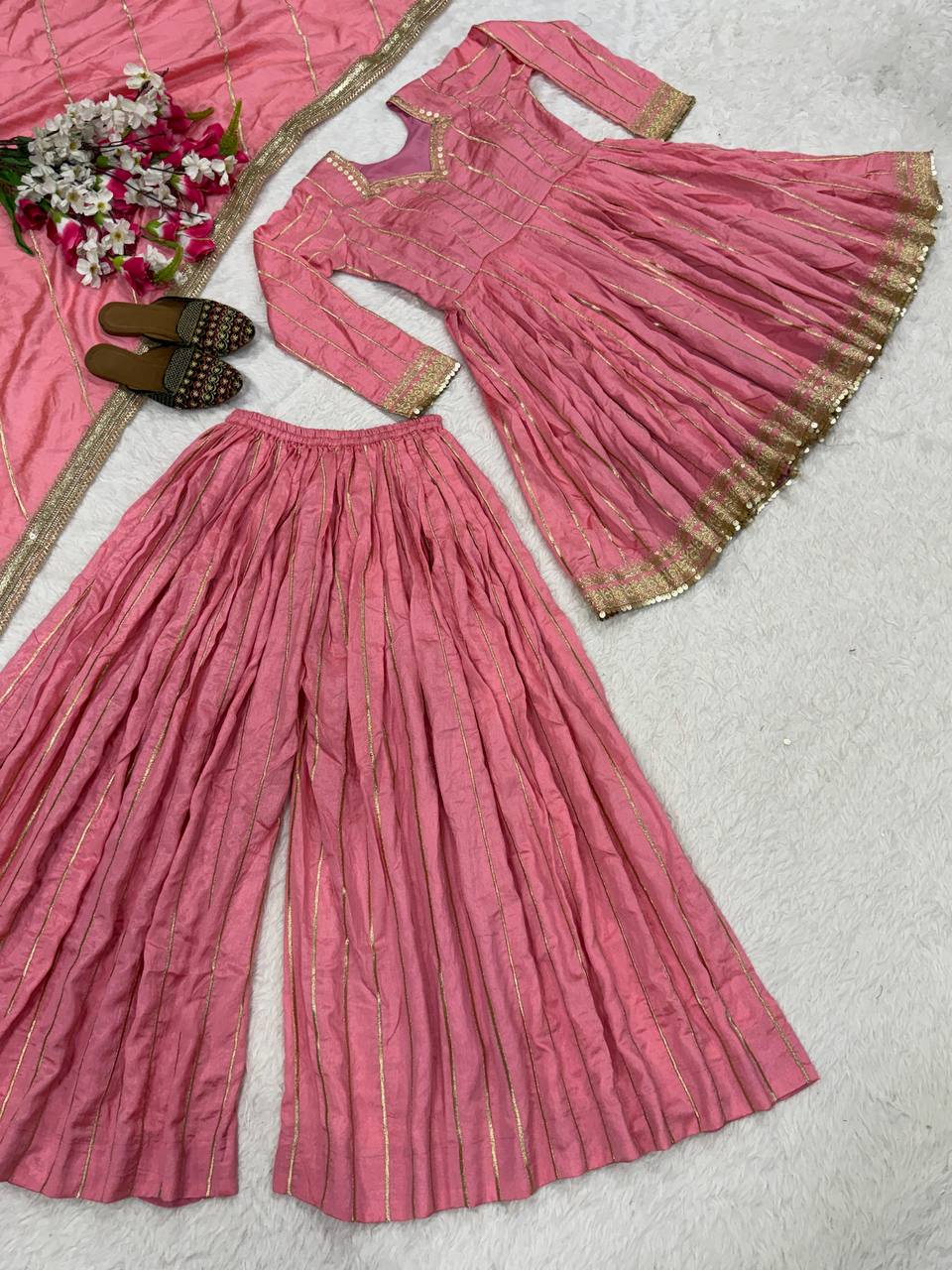 Radiant Rose Pink Flared Peplum Kurti and Sharara Set Embellished with Luminous Gold Zari Stripes and Sequined Borders